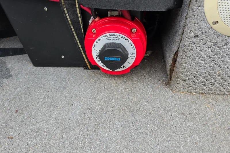 Slide: The Image of Battery switch in a 2011 Bayliner 180 Bowrider boat interior. - 20