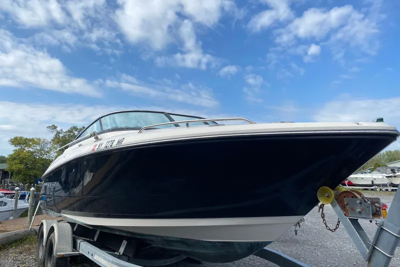 The Image of 2007 Monterey 234FSX boat on trailer under blue sky. - 1