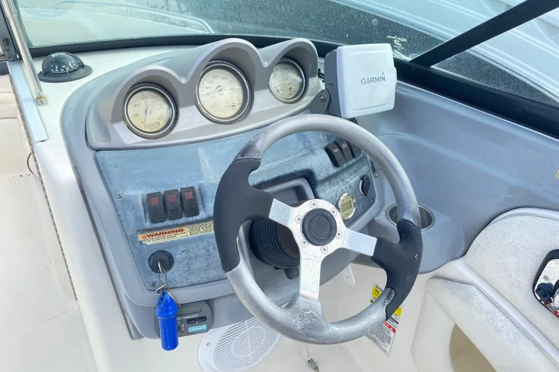 Slide: The Image of Steering console of a 2007 Monterey 234FSX boat with Garmin navigation system. - 14