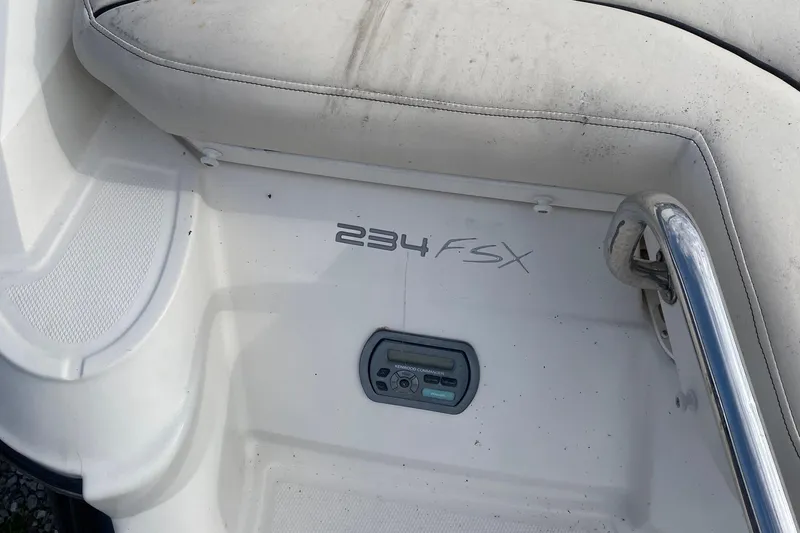 Slide: The Image of 2007 Monterey 234FSX boat interior with control panel and seating area. - 7