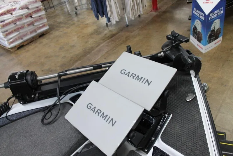 Slide: The Image of 2026 Phoenix 21 XE boat with Garmin electronics in a showroom. - 4