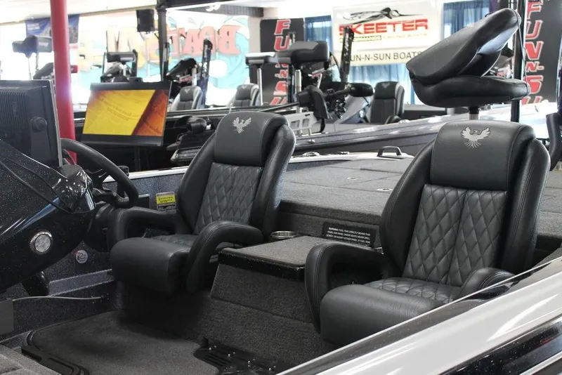Slide: The Image of 2026 Phoenix 21 XE boat interior with luxurious black leather seats. - 9