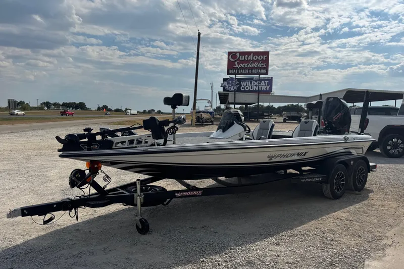 Slide: The Image of 2026 Phoenix 721 ZXL boat on trailer at outdoor dealership under cloudy sky. - 4
