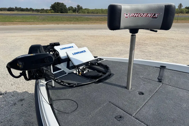 Slide: The Image of Phoenix 721 ZXL boat deck with Lowrance electronics and branded seat, 2026 model. - 5