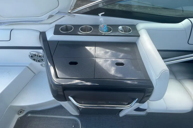 Slide: The Image of 2016 Formula 310 Bowrider interior with cup holders and seating area. - 20