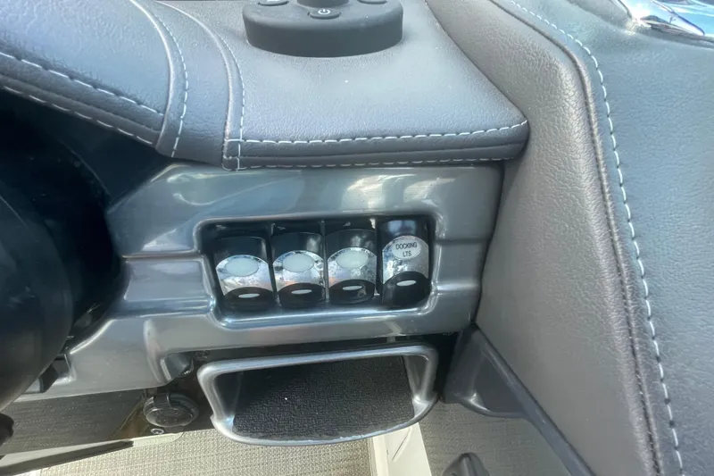Slide: The Image of Control panel of a 2016 Formula 310 Bowrider boat with docking lights switches. - 29
