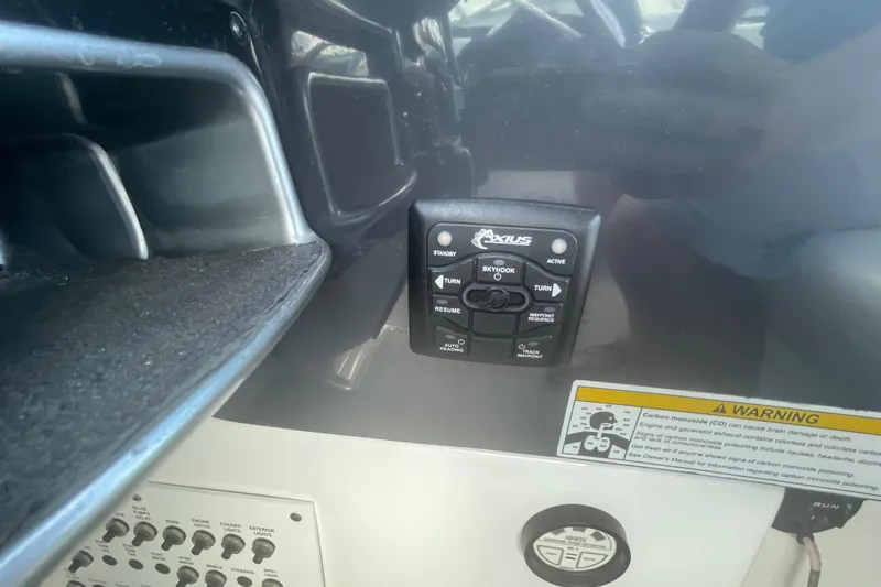 Slide: The Image of Control panel of a 2016 Formula 310 Bowrider boat with warning label. - 32