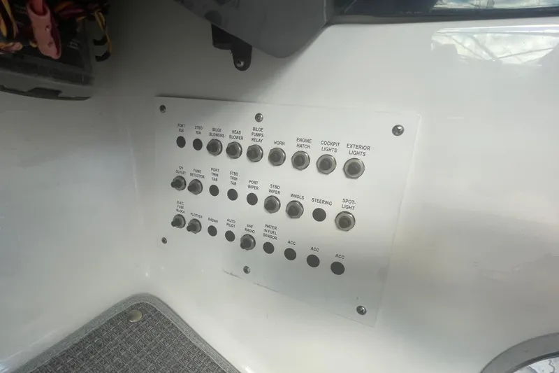 Slide: The Image of Control panel of a 2016 Formula 310 Bowrider boat with labeled switches and buttons. - 33