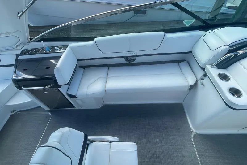 Slide: The Image of 2016 Formula 310 Bowrider interior with white seating and sleek design. - 34