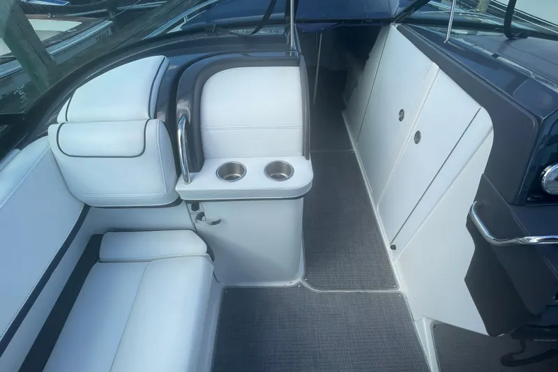 Slide: The Image of 2016 Formula 310 Bowrider interior with white seating and cup holders. - 37