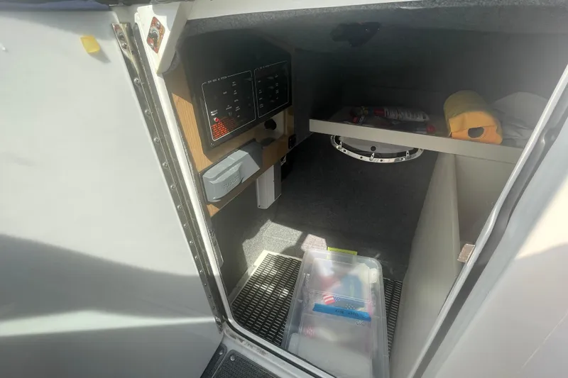Slide: The Image of Interior cabin of a 2016 Formula 310 Bowrider boat with storage and control panel. - 46
