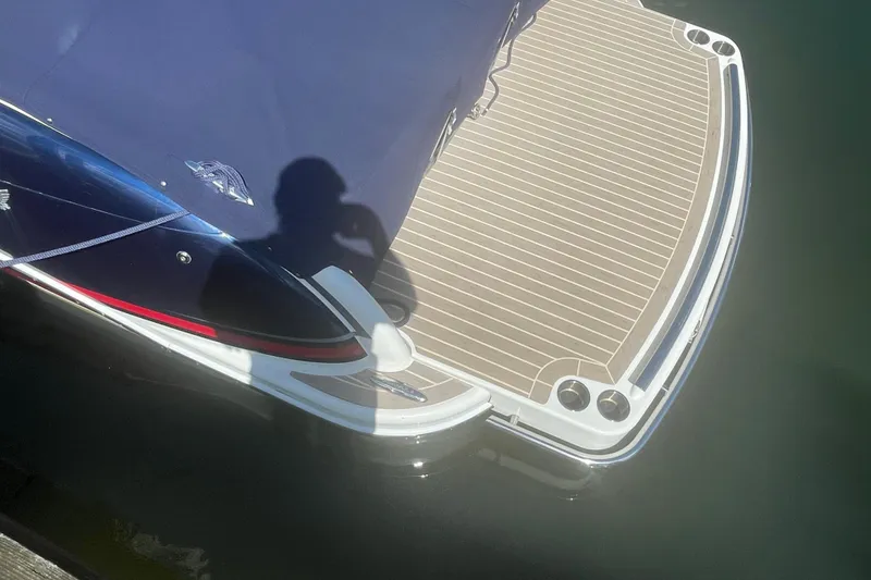 Slide: The Image of 2016 Formula 310 Bowrider boat with covered deck and swim platform. - 5