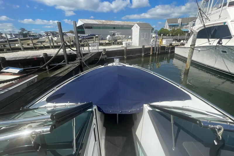 Slide: The Image of 2016 Formula 310 Bowrider docked at marina under blue sky. - 50