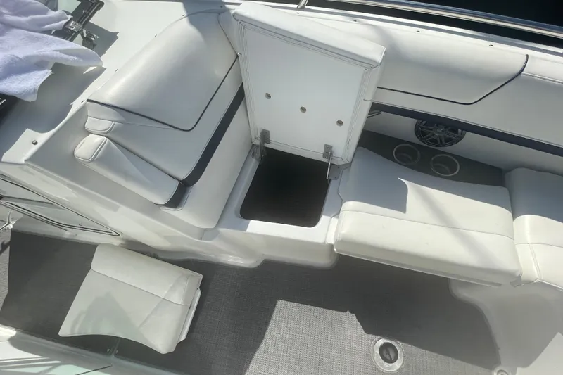 Slide: The Image of 2016 Formula 310 Bowrider interior with white seating and storage compartment. - 57