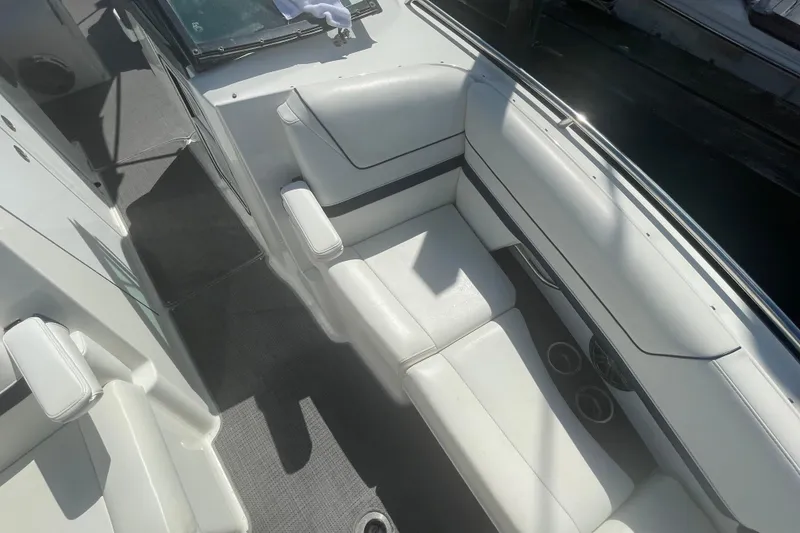 Slide: The Image of 2016 Formula 310 Bowrider interior with white seating and cup holders. - 58