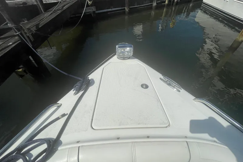 Slide: The Image of Bow of 2016 Formula 310 Bowrider docked at marina. - 60