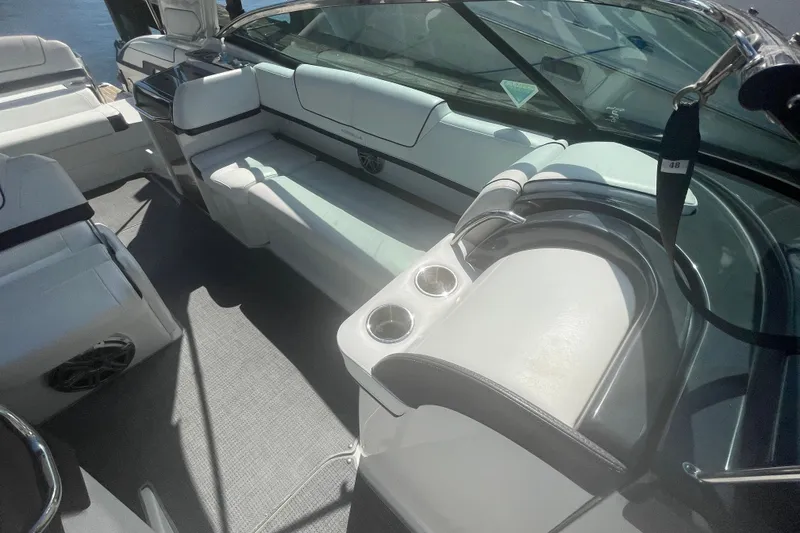 Slide: The Image of 2016 Formula 310 Bowrider interior with white seating and cup holders. - 68