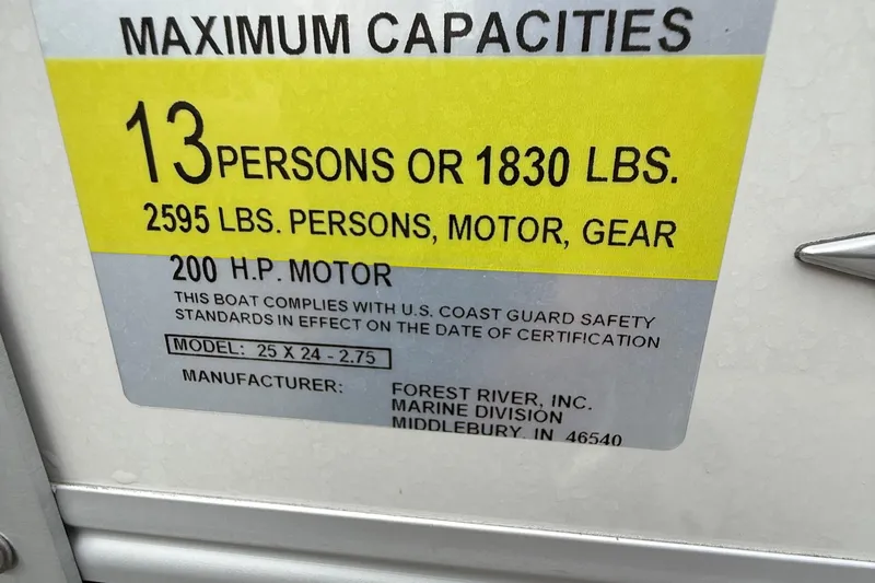Slide: The Image of Capacity label for 2025 Berkshire 24RFC CTS 2.75, 13 persons, 2595 lbs, 200 HP motor. - 12