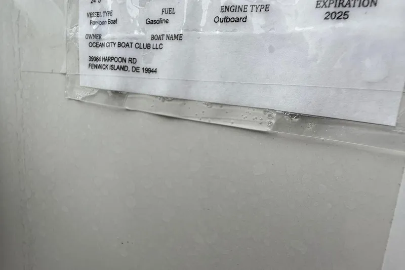 Slide: The Image of Label on a Berkshire 24RFC CTS 2.75 pontoon boat, Ocean City Boat Club, expiration 2025. - 13