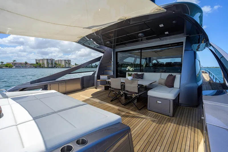 Slide: The Image of Luxurious 2022 Pershing 9X yacht with elegant seating, cruising on a sunny day. - 16