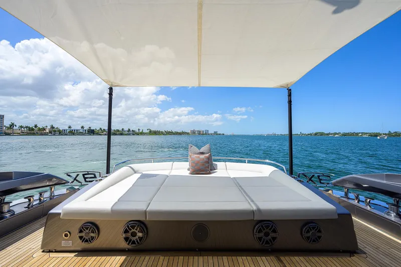 Slide: The Image of Luxurious 2022 Pershing 9X yacht cockpit with advanced navigation systems and waterfront city view. - 20