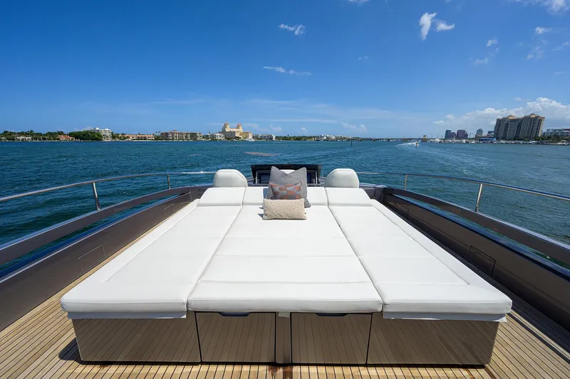 Slide: The Image of Luxurious 2022 Pershing 9X yacht deck with elegant seating and ocean view. - 27