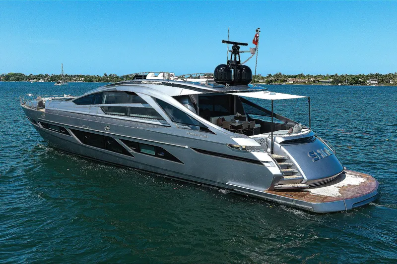 Slide: The Image of 2022 Pershing 9X luxury yacht cruising on open water under clear blue skies. - 3