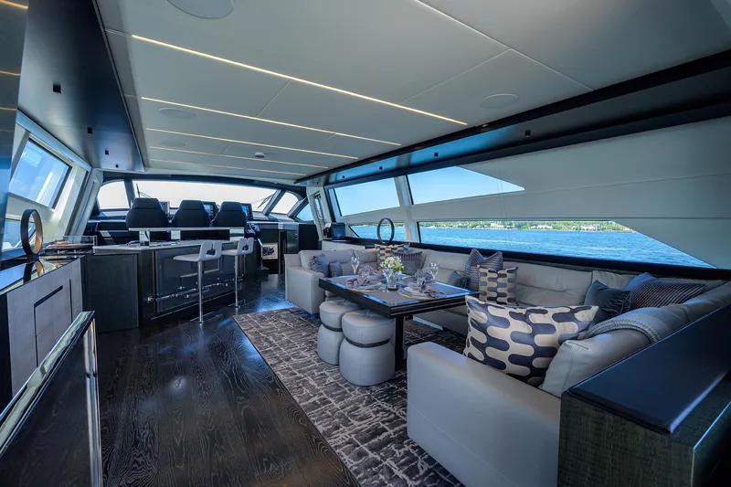 Slide: The Image of Luxurious 2022 Pershing 9X yacht deck with elegant outdoor seating and ocean view. - 30