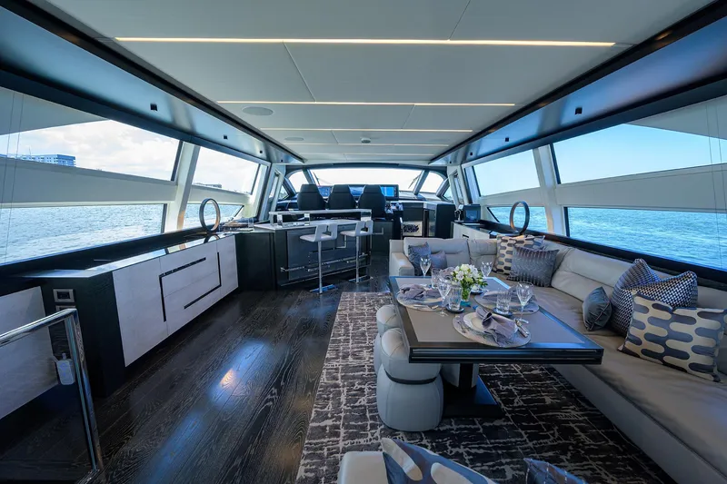 Slide: The Image of Luxurious 2022 Pershing 9X yacht deck with elegant seating and ocean view. - 31