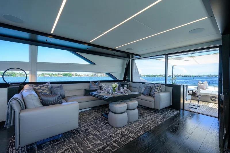 Slide: The Image of Luxury Pershing 9X yacht deck with sunbed, ocean view, and canopy, 2022 model. - 33