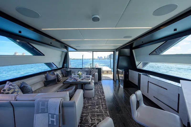 Slide: The Image of Luxury Pershing 9X yacht deck overlooking serene blue ocean, 2022 model. - 34