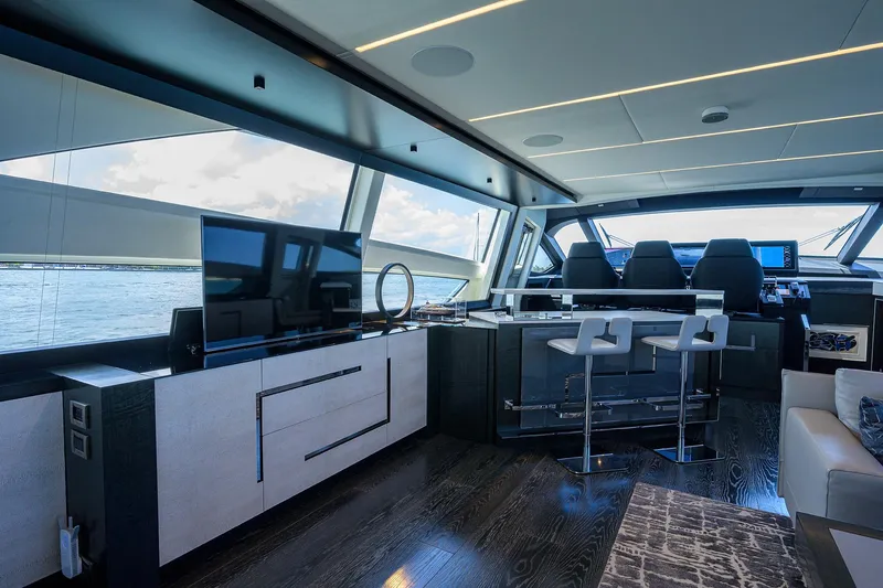 Slide: The Image of Luxurious interior of 2022 Pershing 9X yacht with elegant seating and panoramic windows. - 37