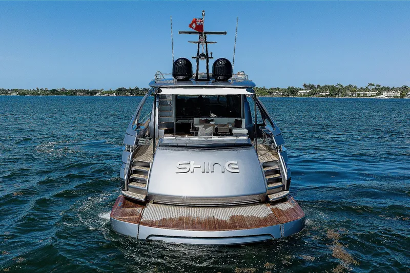 Slide: The Image of 2022 Pershing 9X luxury yacht cruising on clear blue waters. - 4