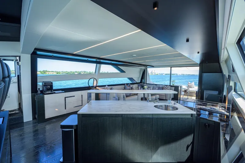 Slide: The Image of Luxurious interior of 2022 Pershing 9X yacht with elegant seating and ocean view. - 40