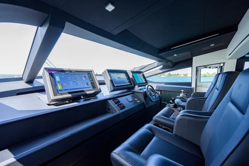 Slide: The Image of Luxurious interior of 2022 Pershing 9X yacht with modern seating and panoramic windows. - 44