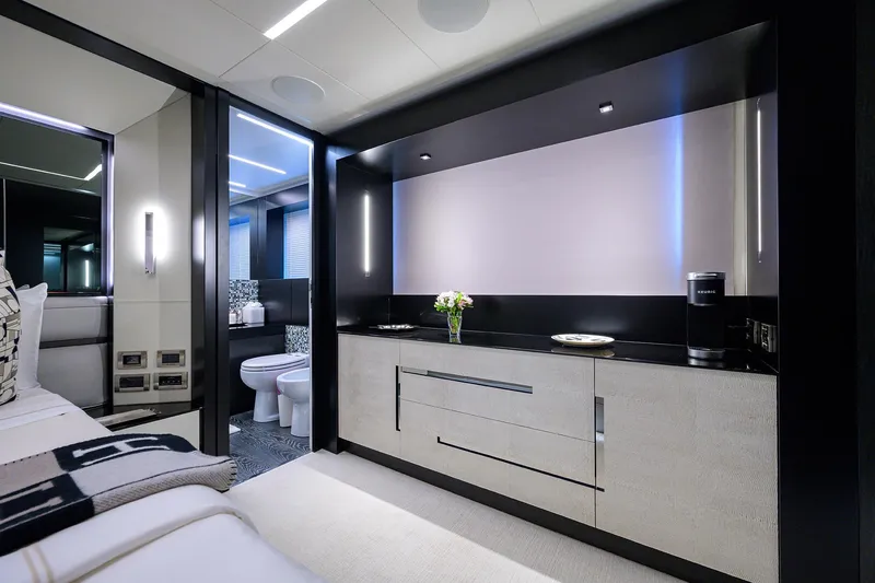 Slide: The Image of Luxurious 2022 Pershing 9X yacht cockpit with advanced navigation systems and sleek black seating. - 49