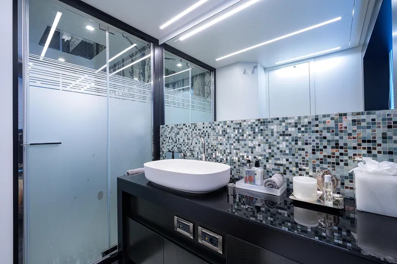 Slide: The Image of Luxurious bedroom interior of 2022 Pershing 9X yacht with modern design and ambient lighting. - 53