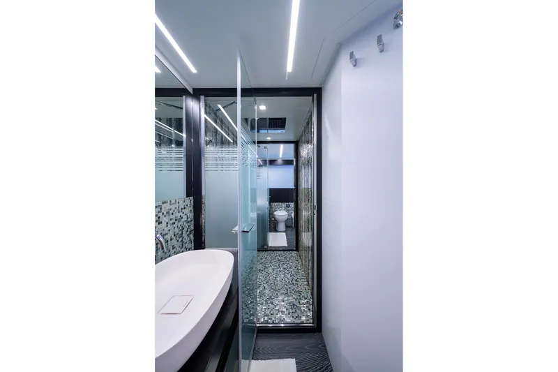 Slide: The Image of Luxurious bathroom interior of 2022 Pershing 9X yacht with modern fixtures and mosaic tiles. - 58