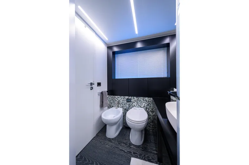 Slide: The Image of Luxurious bathroom in 2022 Pershing 9X yacht with modern fixtures and mosaic tiles. - 59