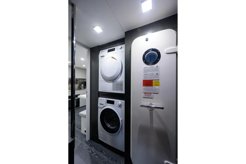 Slide: The Image of Luxurious 2022 Pershing 9X yacht interior with modern twin beds and elegant decor. - 74