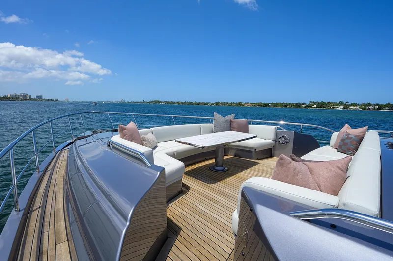 Slide: The Image of 2022 Pershing 9X luxury yacht cruising on open water. - 8