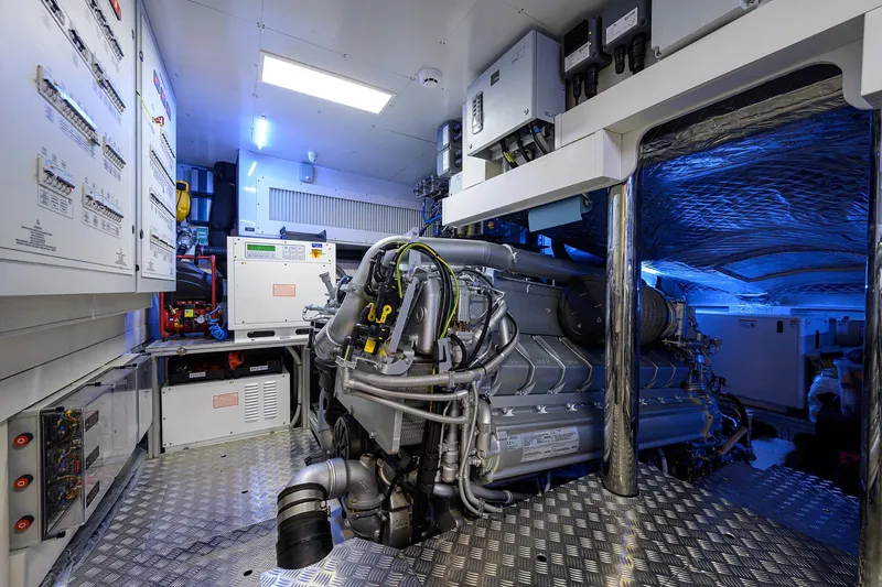 Slide: The Image of Laundry area inside 2022 Pershing 9X yacht, featuring modern washer and dryer units. - 81