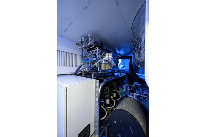 Slide: The Image of Modern interior of 2022 Pershing 9X yacht with sleek design and compact dining area. - 83