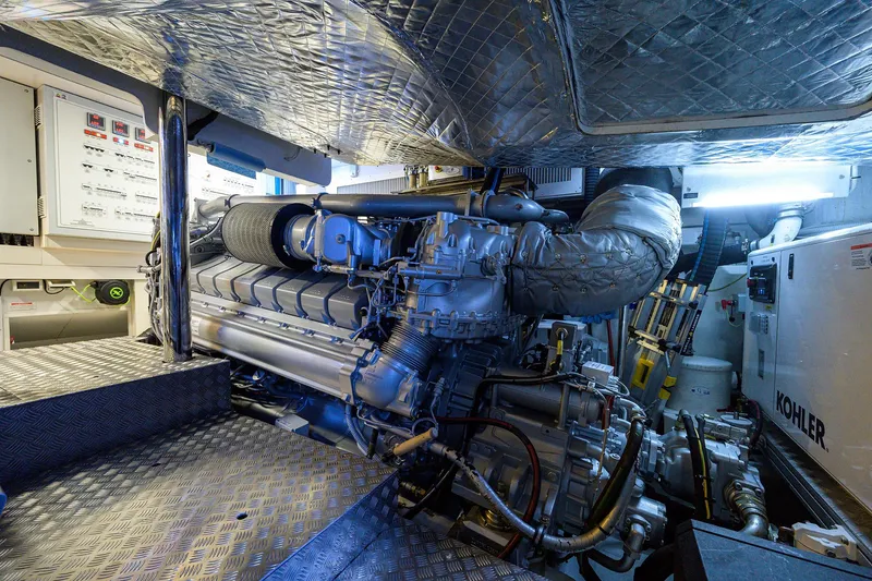Slide: The Image of Engine room of 2022 Pershing 9X yacht, showcasing advanced mechanical systems and components. - 90