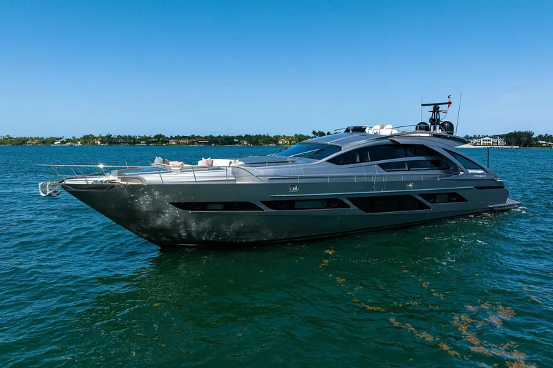 Slide: The Image of Engine compartment of 2022 Pershing 9X yacht with visible wiring and metal flooring. - 94