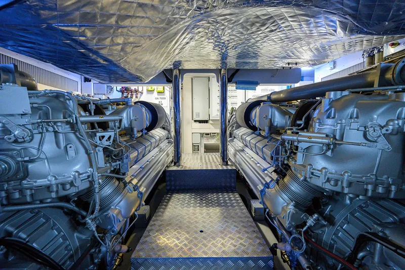 Slide: The Image of Engine room of 2022 Pershing 9X yacht, showcasing advanced machinery and equipment. - 99