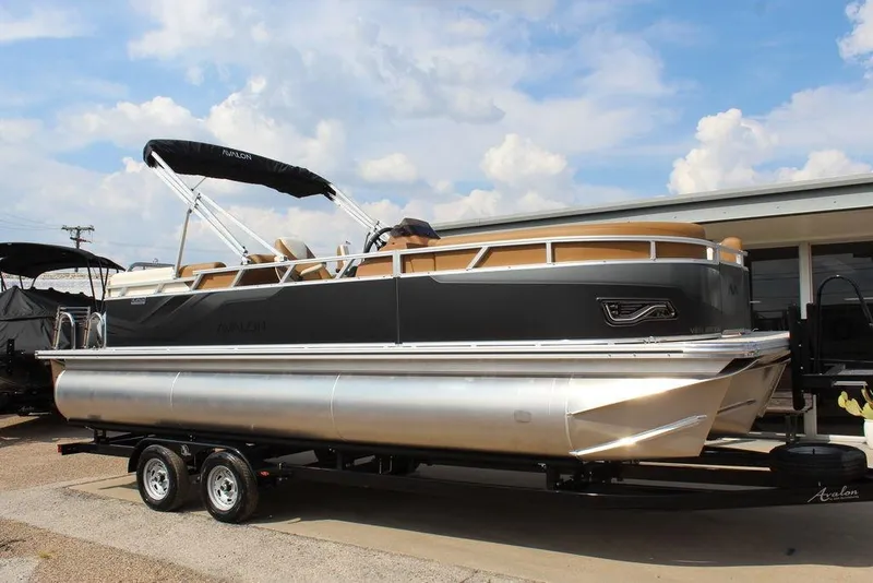 The Image of 2026 Avalon Venture 85 Quad Lounger 23 FT pontoon boat on trailer, under blue sky. - 1