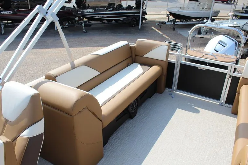 Slide: The Image of 2026 Avalon Venture 85 Quad Lounger interior with tan and white seating, spacious layout. - 12
