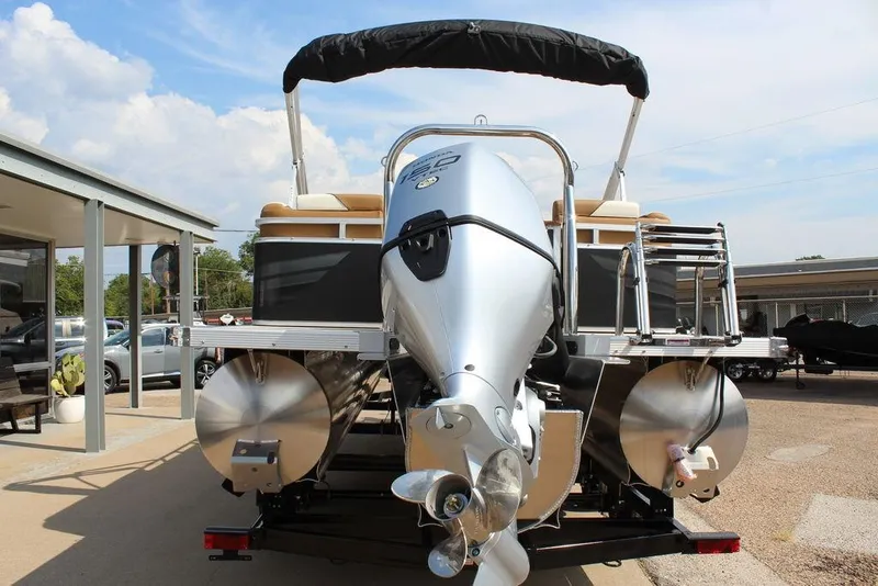 Slide: The Image of 2026 Avalon Venture 85 Quad Lounger 23 FT pontoon boat with powerful outboard motor. - 3