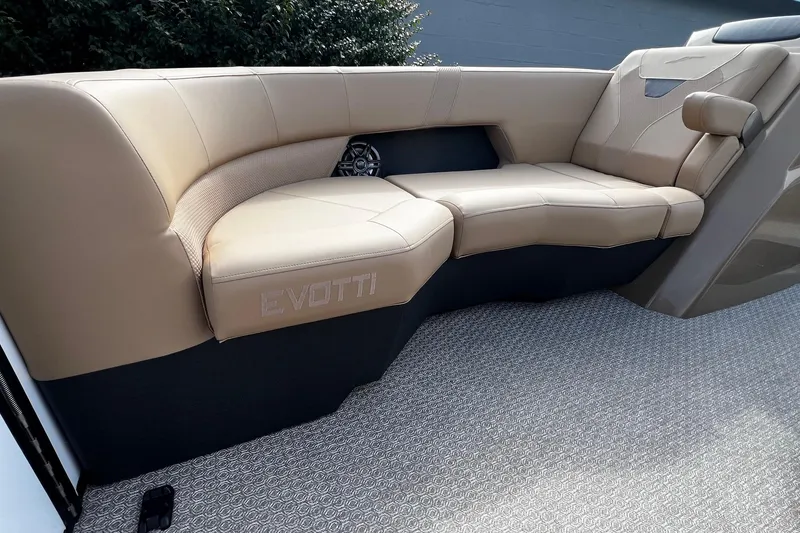 Slide: The Image of Interior of 2026 Evotti 523CS boat with beige seating and modern dashboard. - 11